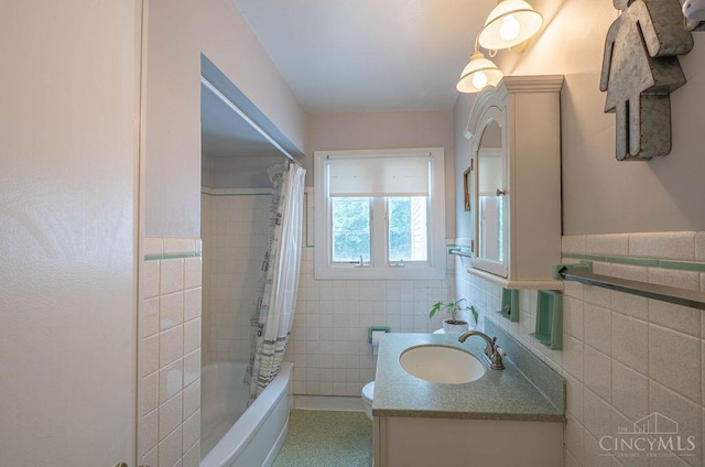 901 W Sunview Dr W, Hamilton, OH 45013 - bathroom featuring tile walls, vanity, shower / bath combo with shower curtain, and wainscoting