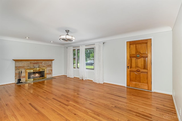 755 Jarole Dr, Union Twp, OH 45245 - unfurnished living room with light wood-style floors and a fireplace