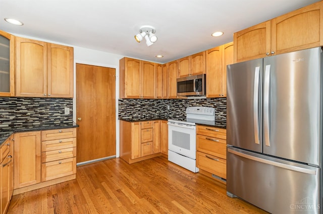755 Jarole Dr, Union Twp, OH 45245 - kitchen with appliances with stainless steel finishes, glass insert cabinets, decorative backsplash, light wood-style floors, and recessed lighting