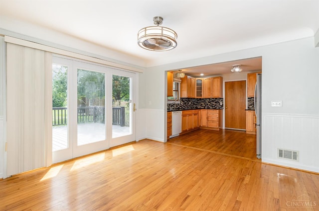 755 Jarole Dr, Union Twp, OH 45245 - unfurnished living room with light wood-style floors and wainscoting