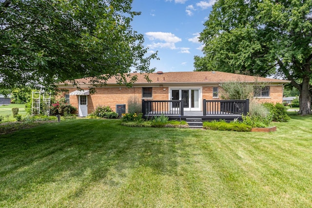 755 Jarole Dr, Union Twp, OH 45245 - rear view of house with brick siding, a deck, and a yard