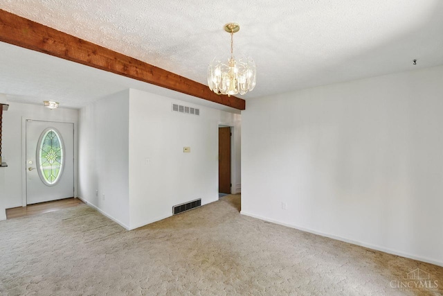 1704 Ludlow Cir, Pierce Twp, OH 45102 - spare room featuring carpet flooring, a chandelier, and beam ceiling