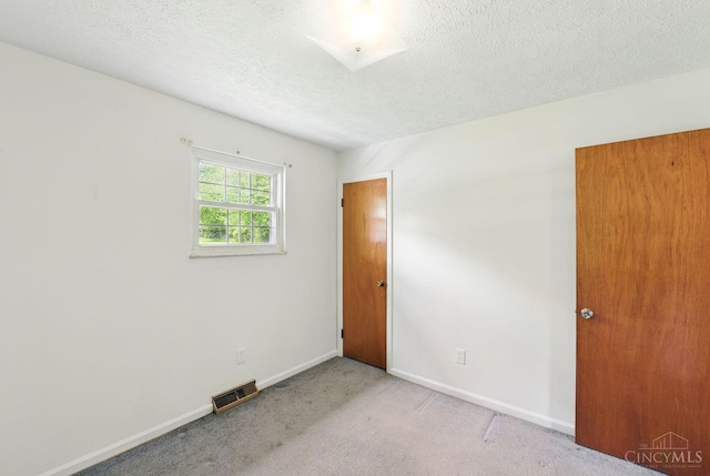 1704 Ludlow Cir, Pierce Twp, OH 45102 - carpeted empty room featuring baseboards and a textured ceiling