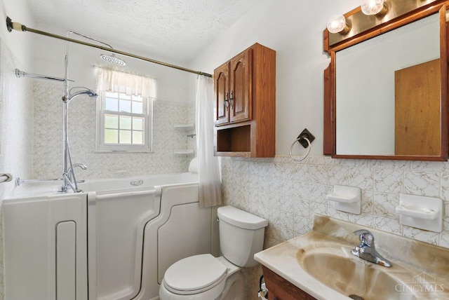 1704 Ludlow Cir, Pierce Twp, OH 45102 - bathroom featuring tile walls, vanity, shower / bath combination with curtain, and a textured ceiling