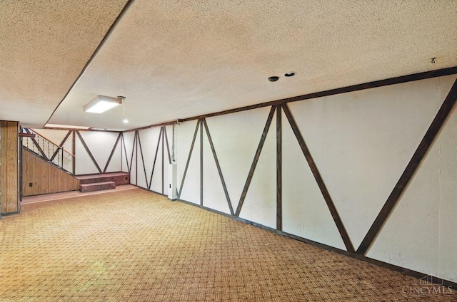 1704 Ludlow Cir, Pierce Twp, OH 45102 - below grade area featuring a textured ceiling and carpet floors