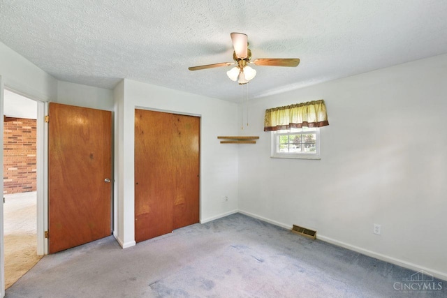 1704 Ludlow Cir, Pierce Twp, OH 45102 - unfurnished bedroom with carpet, ceiling fan, a textured ceiling, and a closet