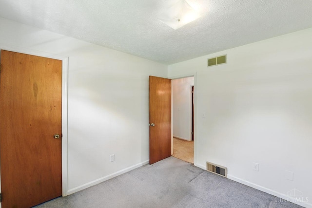 1704 Ludlow Cir, Pierce Twp, OH 45102 - unfurnished bedroom with carpet floors and a textured ceiling
