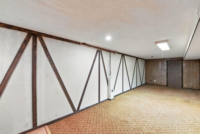 1704 Ludlow Cir, Pierce Twp, OH 45102 - finished below grade area featuring light colored carpet, a textured ceiling, and wood walls