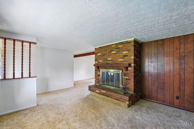 1704 Ludlow Cir, Pierce Twp, OH 45102 - unfurnished living room with carpet flooring, a brick fireplace, a textured ceiling, and wooden walls