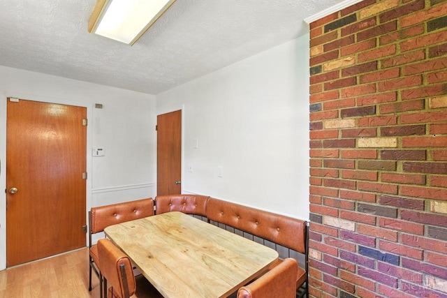 1704 Ludlow Cir, Pierce Twp, OH 45102 - dining space with a textured ceiling and light wood finished floors