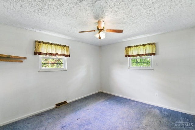 1704 Ludlow Cir, Pierce Twp, OH 45102 - unfurnished room featuring plenty of natural light, carpet floors, ceiling fan, and a textured ceiling