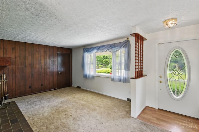 1704 Ludlow Cir, Pierce Twp, OH 45102 - entryway featuring a textured ceiling and wooden walls