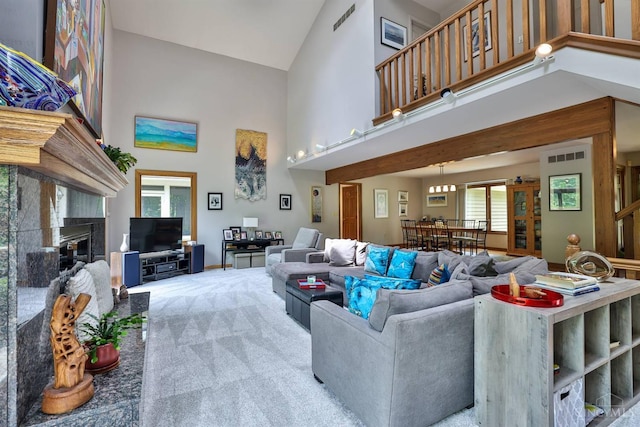 9396 Kemper Grove Ln, Symmes Twp, OH 45140 - carpeted living room with high vaulted ceiling and a premium fireplace
