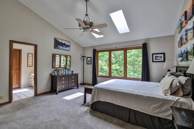 9396 Kemper Grove Ln, Symmes Twp, OH 45140 - carpeted bedroom with a skylight, high vaulted ceiling, connected bathroom, and a ceiling fan