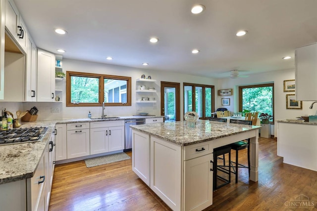 9396 Kemper Grove Ln, Symmes Twp, OH 45140 - kitchen with open shelves, appliances with stainless steel finishes, a kitchen breakfast bar, white cabinets, and recessed lighting