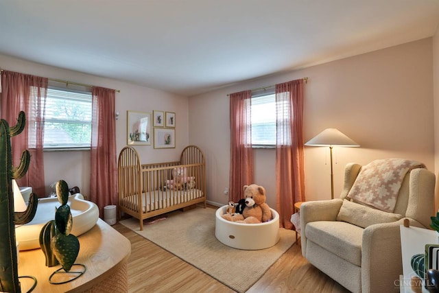 10569 Gloria Ave, Cincinnati, OH 45231 - bedroom with wood finished floors and a crib