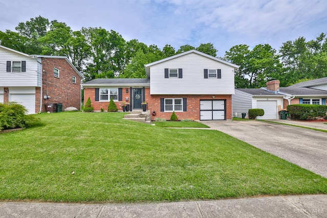 10569 Gloria Ave, Cincinnati, OH 45231 - split level home featuring brick siding, concrete driveway, a garage, and a front yard