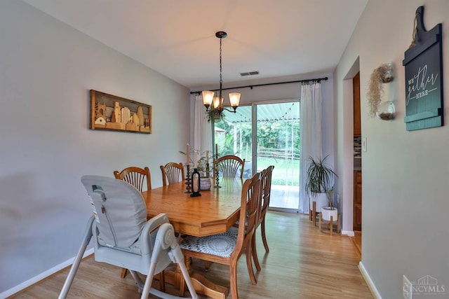 10569 Gloria Ave, Cincinnati, OH 45231 - dining area with a chandelier and light wood-style floors