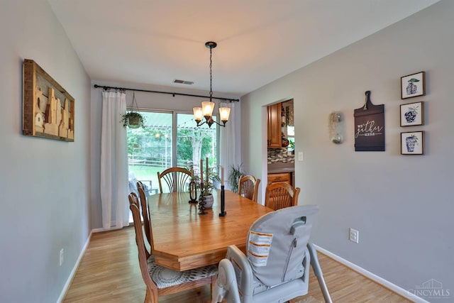 10569 Gloria Ave, Cincinnati, OH 45231 - dining area with a chandelier and light wood-type flooring