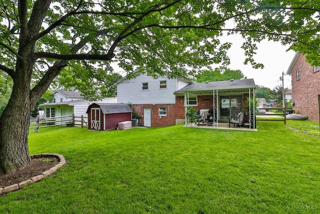 10569 Gloria Ave, Cincinnati, OH 45231 - back of house featuring brick siding, a shed, and a patio
