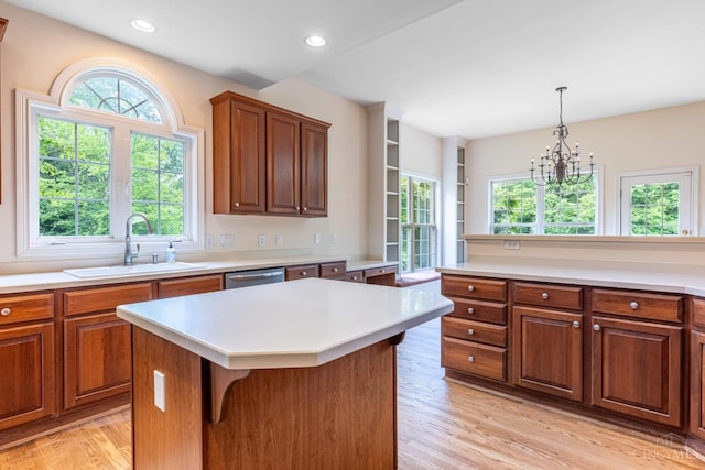 7194 Orchard View Ln, Salem Twp, OH 45152 - kitchen featuring light wood-style floors, light countertops, stainless steel dishwasher, brown cabinetry, and recessed lighting