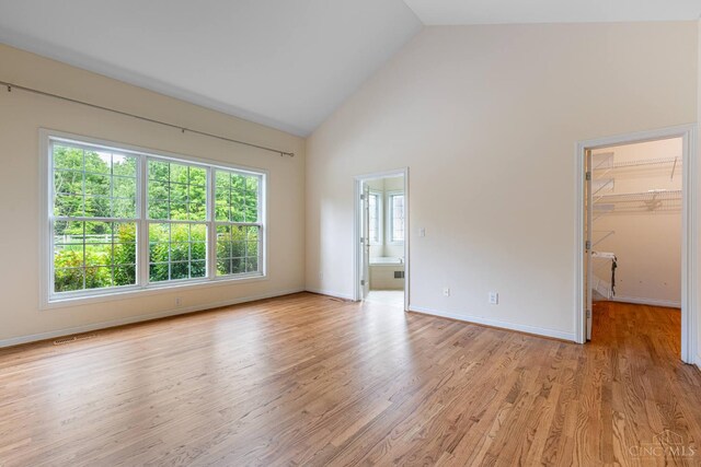 7194 Orchard View Ln, Salem Twp, OH 45152 - unfurnished room with high vaulted ceiling and light wood-style flooring