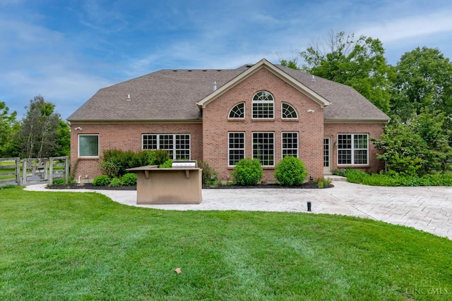 7194 Orchard View Ln, Salem Twp, OH 45152 - rear view of house featuring a patio area, brick siding, and roof with shingles