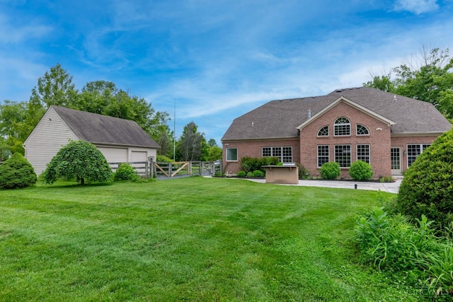 7194 Orchard View Ln, Salem Twp, OH 45152 - back of house with a gate, a garage, and brick siding