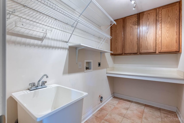 7194 Orchard View Ln, Salem Twp, OH 45152 - laundry area featuring electric dryer hookup, cabinet space, and washer hookup