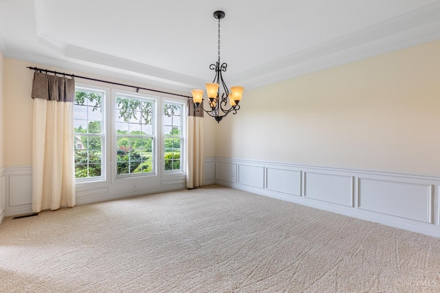 7194 Orchard View Ln, Salem Twp, OH 45152 - carpeted empty room with a decorative wall, ornamental molding, a chandelier, a raised ceiling, and wainscoting