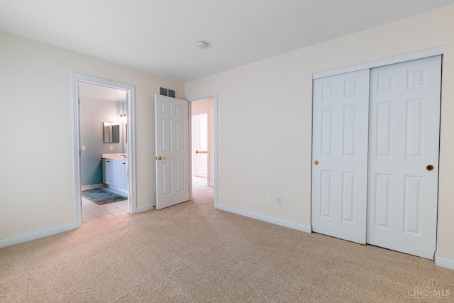 7194 Orchard View Ln, Salem Twp, OH 45152 - unfurnished bedroom with light colored carpet, a closet, and connected bathroom