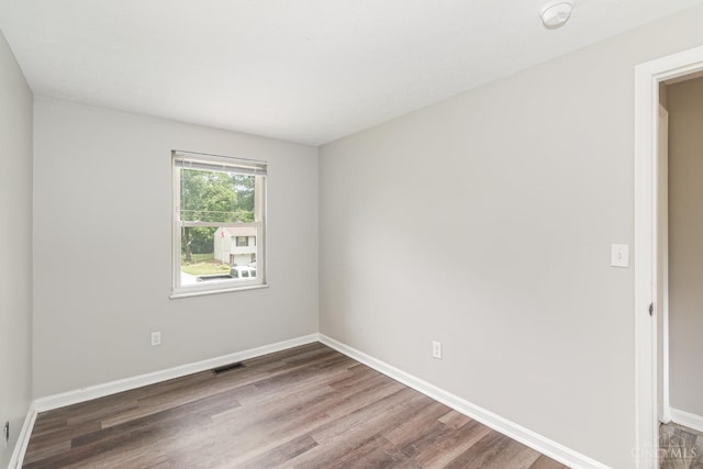 9733 Gertrude Ln, Springfield Twp, OH 45231 - empty room featuring wood finished floors and a smoke detector