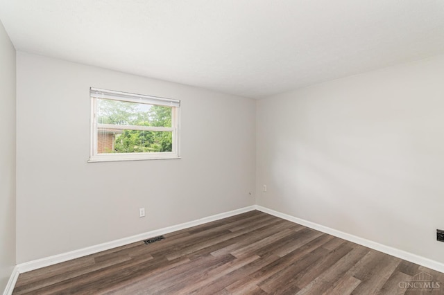 9733 Gertrude Ln, Springfield Twp, OH 45231 - spare room featuring dark wood finished floors and baseboards