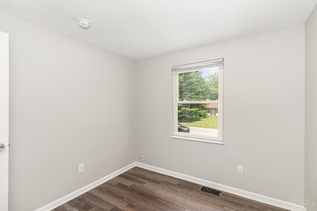 9733 Gertrude Ln, Springfield Twp, OH 45231 - spare room with dark wood finished floors and a smoke detector