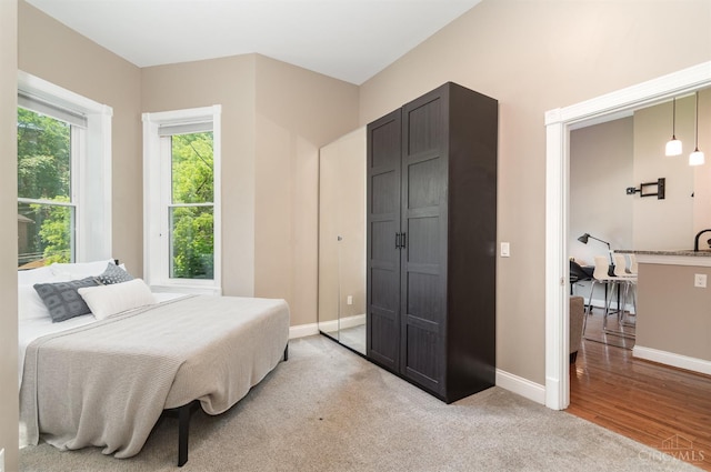 2110 Fulton Ave Unit D1, Cincinnati, OH 45206 - bedroom with baseboards and light wood-style flooring