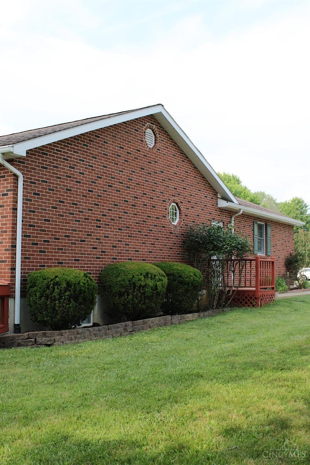 10 Chippewa Cv, Sardinia, OH 45171 - view of home's exterior with brick siding, a yard, and a wooden deck