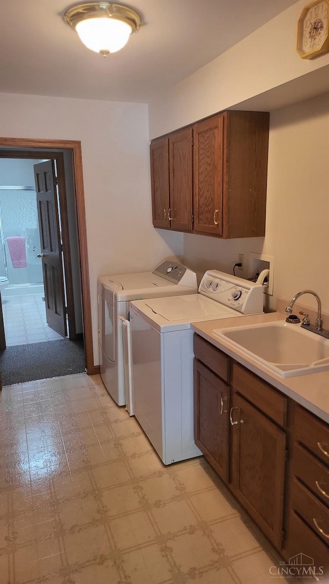 10 Chippewa Cv, Sardinia, OH 45171 - washroom with washing machine and clothes dryer, cabinet space, and light flooring