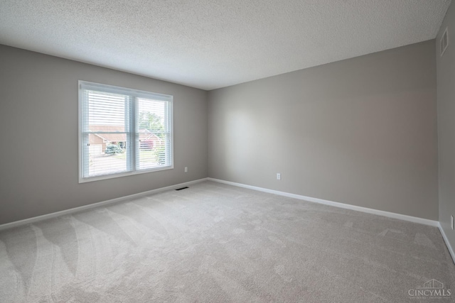 1606 Thall Dr, Hamilton, OH 45013 - spare room with light carpet and a textured ceiling