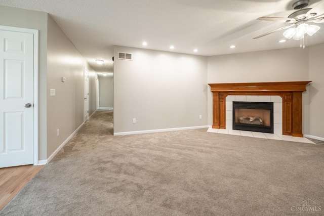 1606 Thall Dr, Hamilton, OH 45013 - unfurnished living room with carpet, a ceiling fan, recessed lighting, and a tiled fireplace