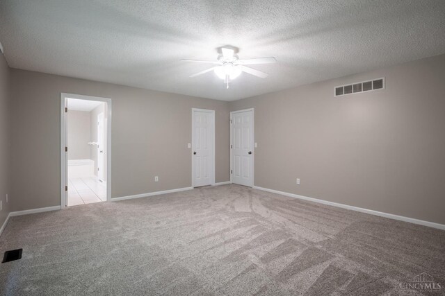1606 Thall Dr, Hamilton, OH 45013 - empty room with a ceiling fan, light carpet, and a textured ceiling