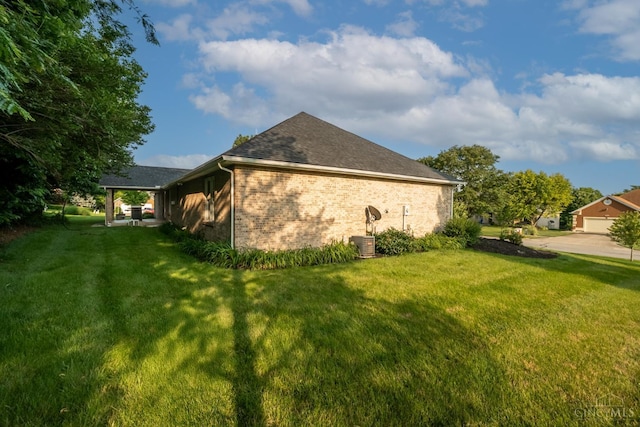 1606 Thall Dr, Hamilton, OH 45013 - view of home's exterior featuring a lawn, brick siding, and a shingled roof