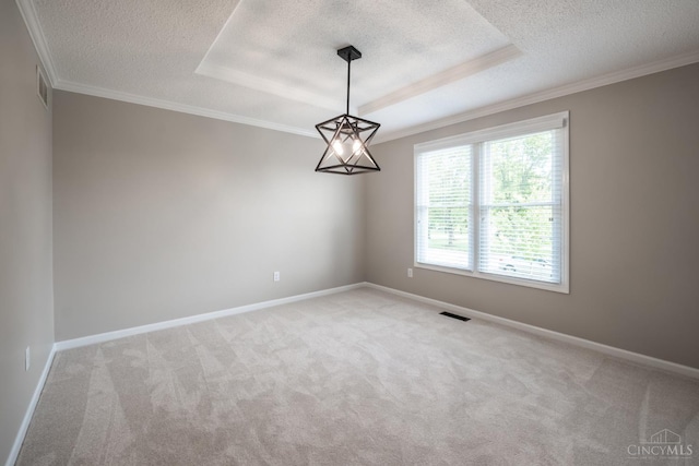 1606 Thall Dr, Hamilton, OH 45013 - empty room featuring a textured ceiling, light colored carpet, ornamental molding, and a tray ceiling