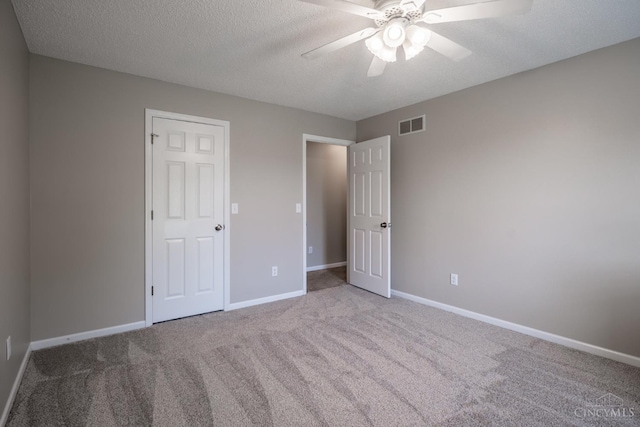 1606 Thall Dr, Hamilton, OH 45013 - unfurnished bedroom featuring carpet, a textured ceiling, and ceiling fan