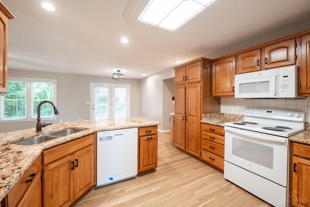 1606 Thall Dr, Hamilton, OH 45013 - kitchen featuring white appliances, light wood finished floors, decorative backsplash, recessed lighting, and light stone countertops