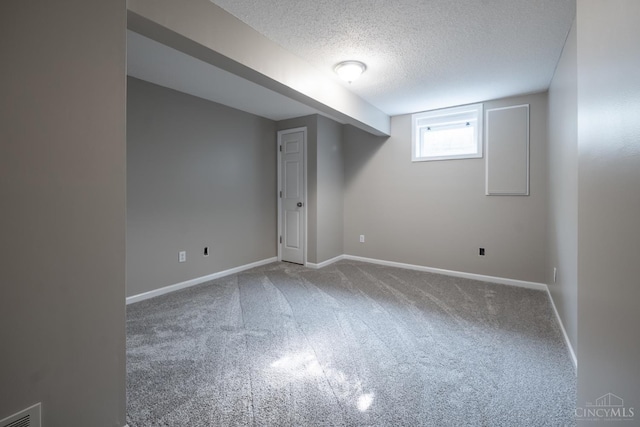1606 Thall Dr, Hamilton, OH 45013 - below grade area with a textured ceiling and carpet