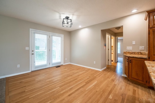 1606 Thall Dr, Hamilton, OH 45013 - unfurnished dining area featuring light wood-type flooring, plenty of natural light, and recessed lighting