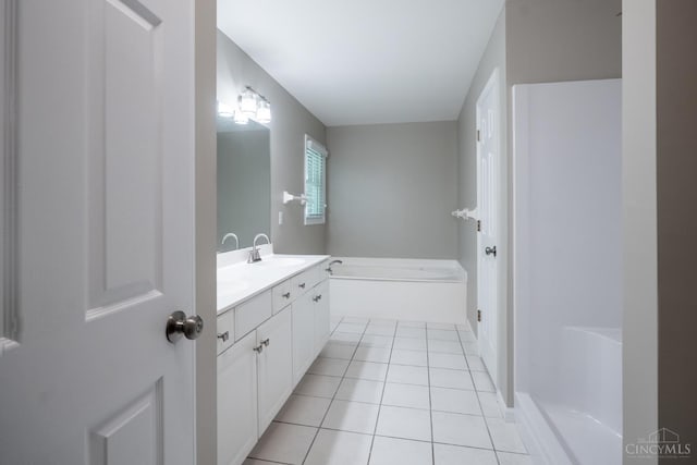 1606 Thall Dr, Hamilton, OH 45013 - full bath with vanity, a garden tub, and tile patterned floors