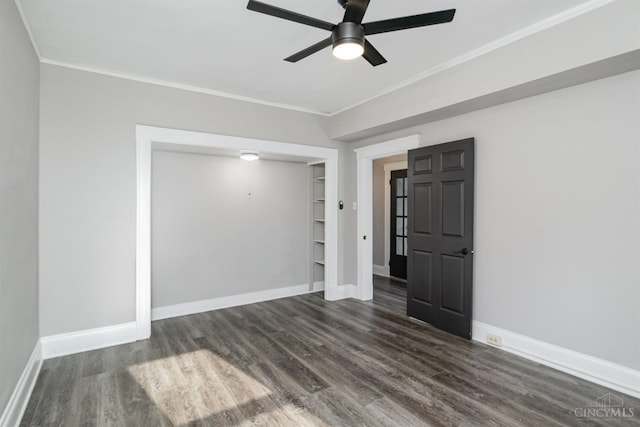 3846 Davis Ave, Cheviot, OH 45211 - spare room featuring crown molding, ceiling fan, dark wood-style floors, and built in features