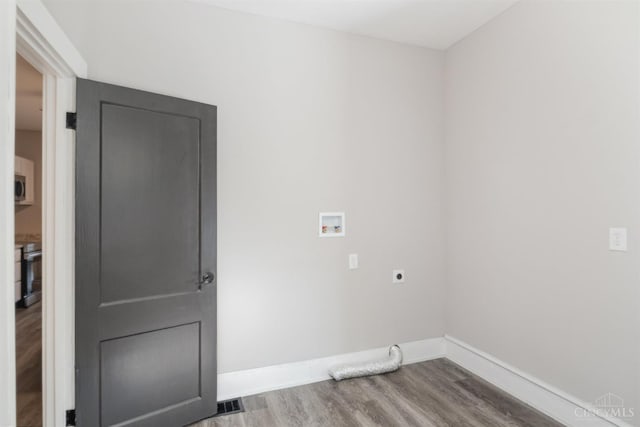 3846 Davis Ave, Cheviot, OH 45211 - laundry area featuring hookup for an electric dryer, hookup for a washing machine, and wood finished floors
