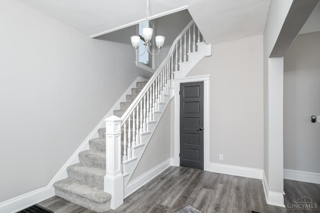 3846 Davis Ave, Cheviot, OH 45211 - stairway with wood finished floors and a chandelier